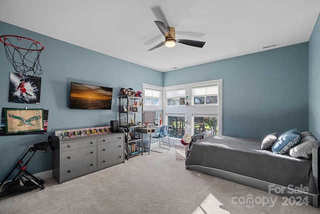 bedroom with light carpet and ceiling fan