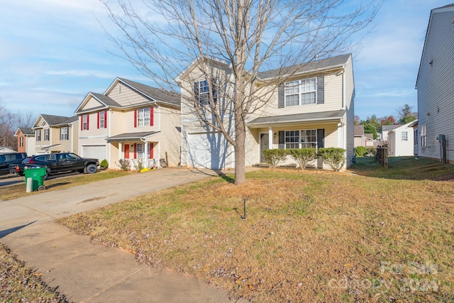 view of front of home featuring a garage and a front yard