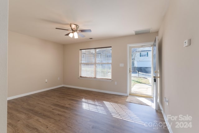 interior space featuring dark hardwood / wood-style flooring and ceiling fan