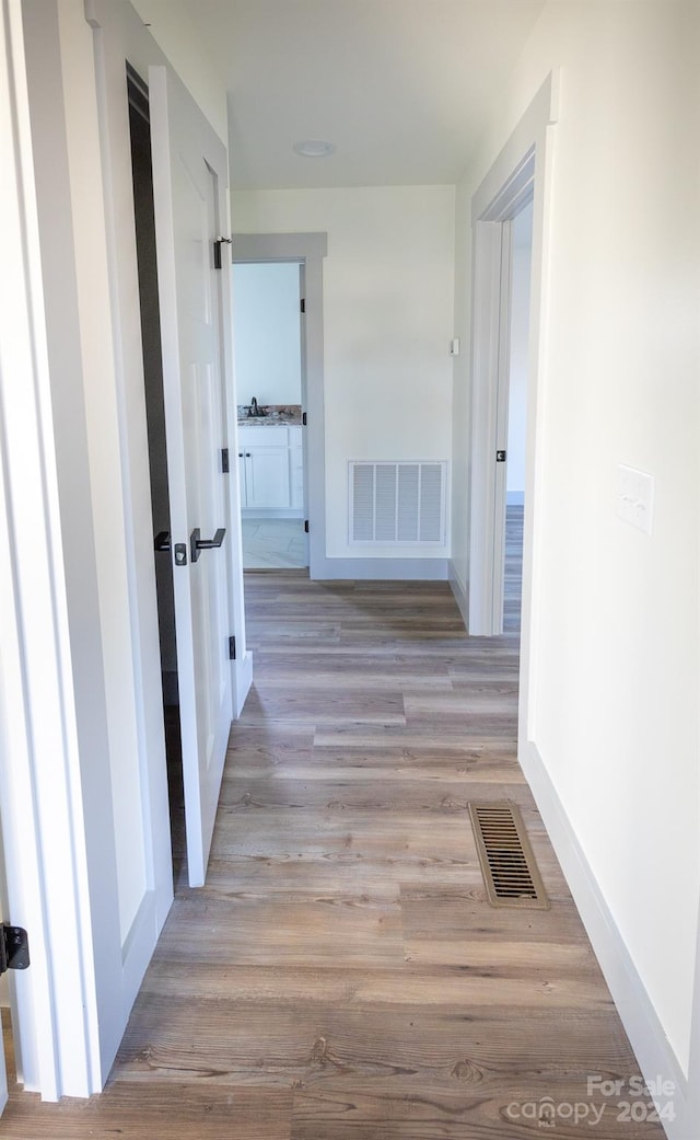 hall featuring light hardwood / wood-style floors