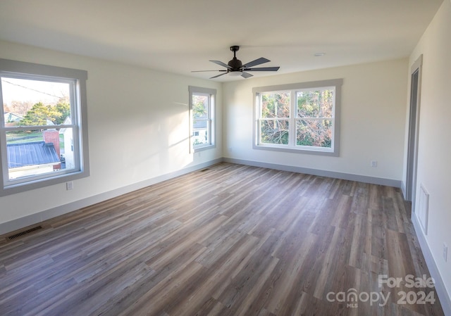 empty room featuring hardwood / wood-style flooring and ceiling fan