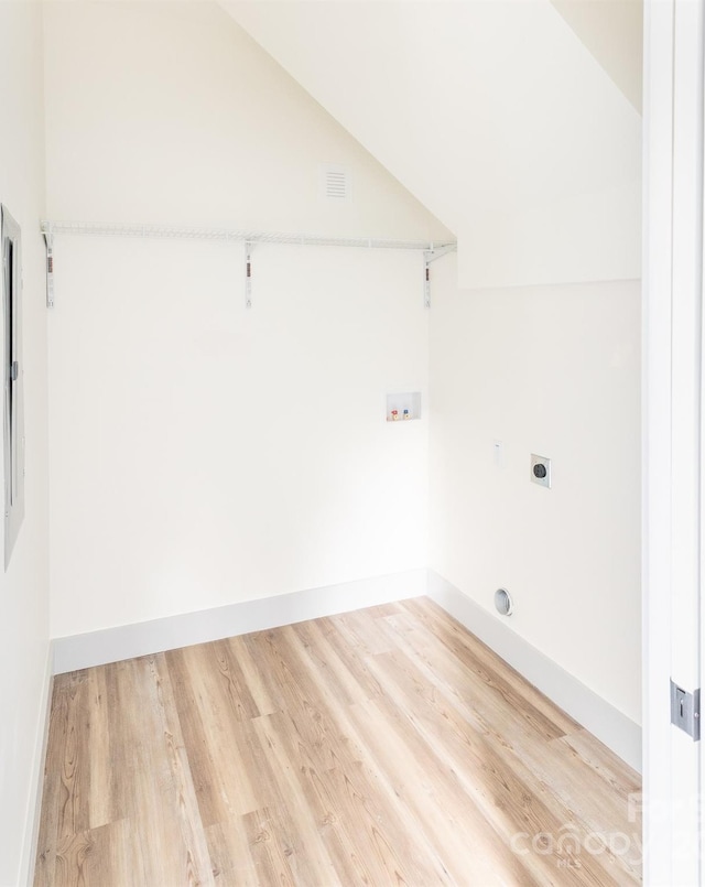 washroom featuring hookup for an electric dryer, washer hookup, and hardwood / wood-style flooring