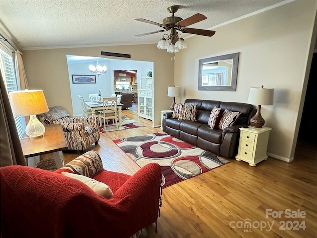 living room featuring hardwood / wood-style floors, a textured ceiling, and crown molding