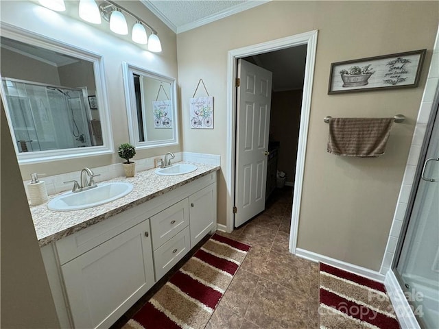 bathroom with tile patterned floors, an enclosed shower, a textured ceiling, vanity, and crown molding