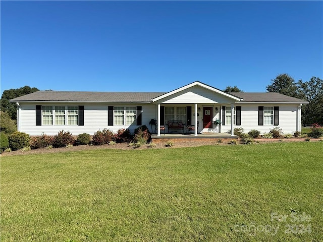 single story home with a porch and a front yard