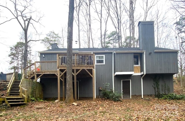 back of property featuring a wooden deck