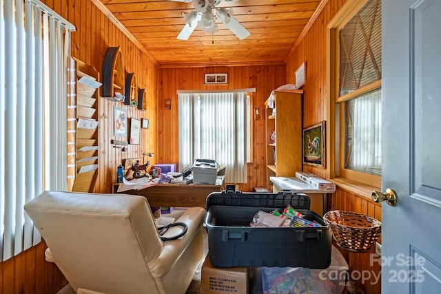 office area featuring a wealth of natural light, wooden ceiling, and wood walls