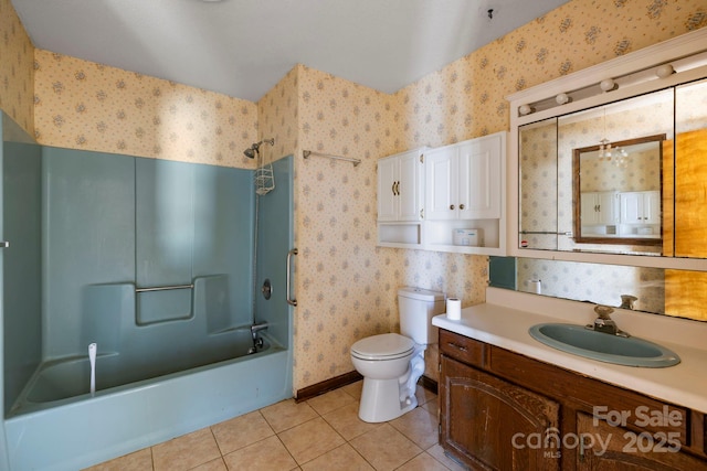 full bathroom with tile patterned floors, toilet, vanity, and washtub / shower combination