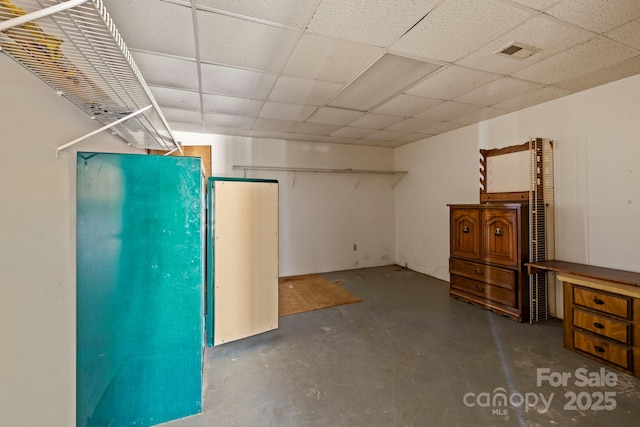 basement featuring a drop ceiling