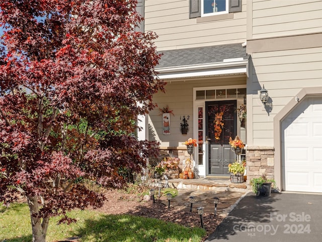 property entrance featuring a garage