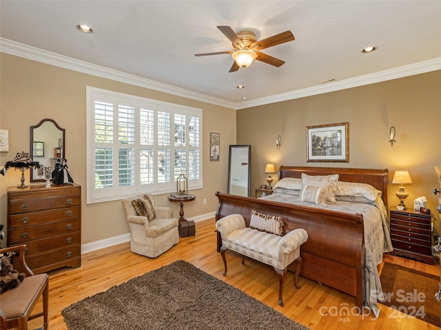 bedroom featuring ceiling fan, crown molding, and light wood-type flooring