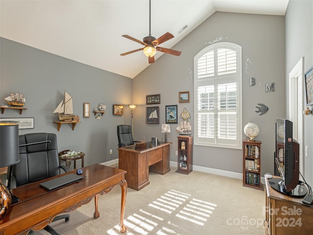 office space with ceiling fan, light colored carpet, and lofted ceiling