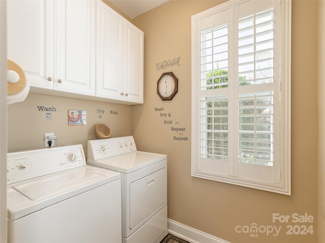 laundry room with cabinets and washing machine and dryer