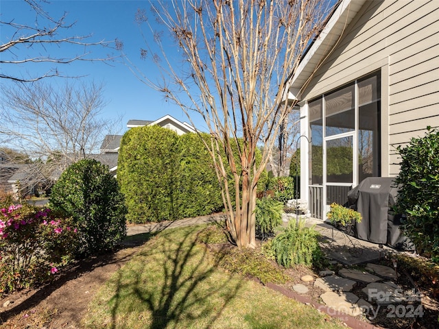 view of yard with a sunroom