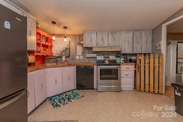 kitchen featuring sink, crown molding, pendant lighting, exhaust hood, and appliances with stainless steel finishes