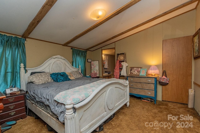 bedroom with lofted ceiling with beams and carpet floors