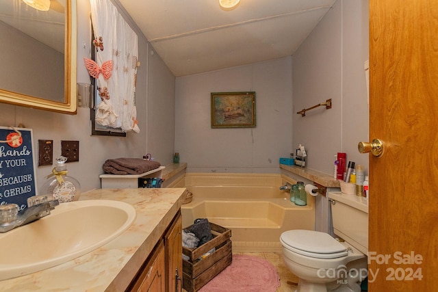 bathroom featuring tile patterned floors, a washtub, vanity, vaulted ceiling, and toilet