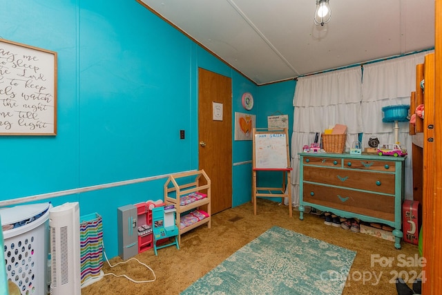 carpeted bedroom with vaulted ceiling