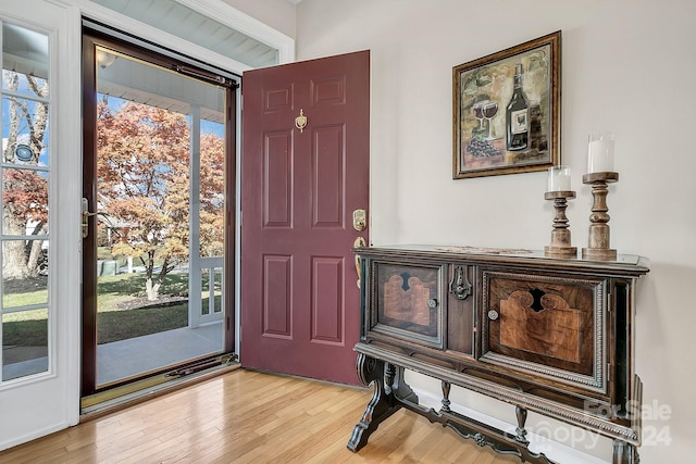 entryway with light hardwood / wood-style floors