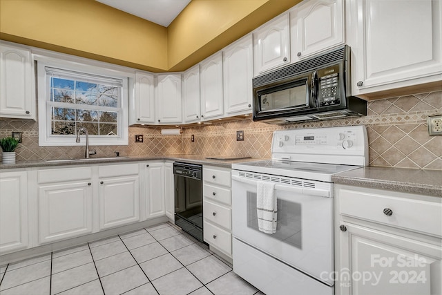 kitchen with white cabinetry, sink, light tile patterned flooring, and black appliances