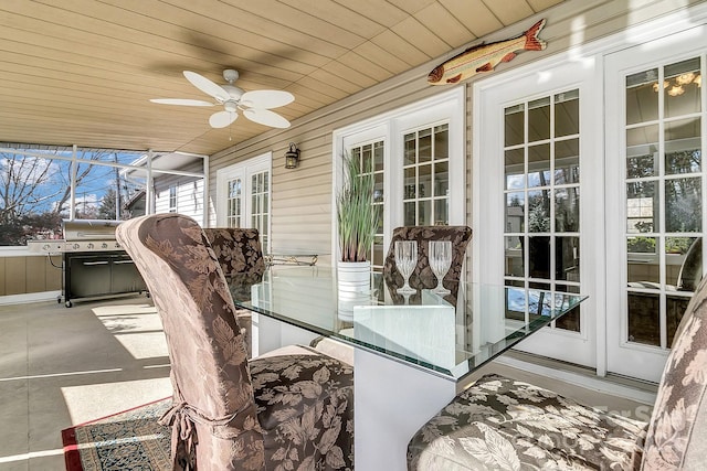 sunroom / solarium with ceiling fan and wood ceiling