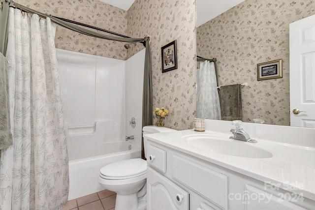 full bathroom with tile patterned flooring, shower / bath combo, vanity, and toilet