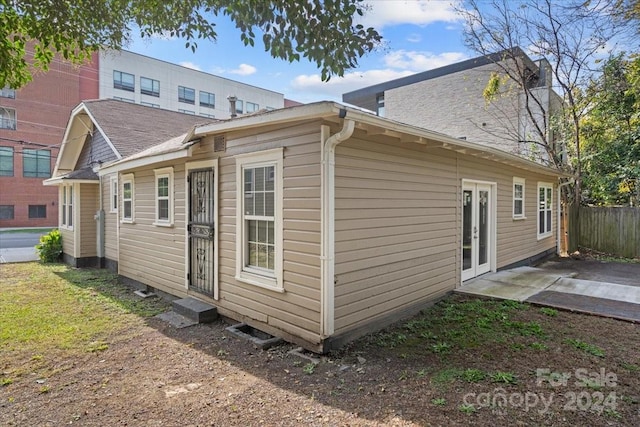 back of property with a patio