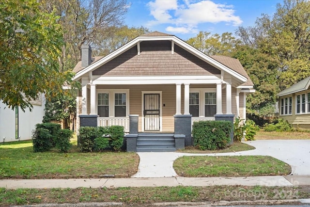 craftsman-style home with covered porch