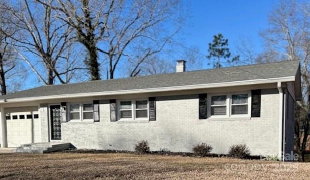 ranch-style house featuring a garage