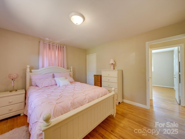 bedroom with light wood-type flooring