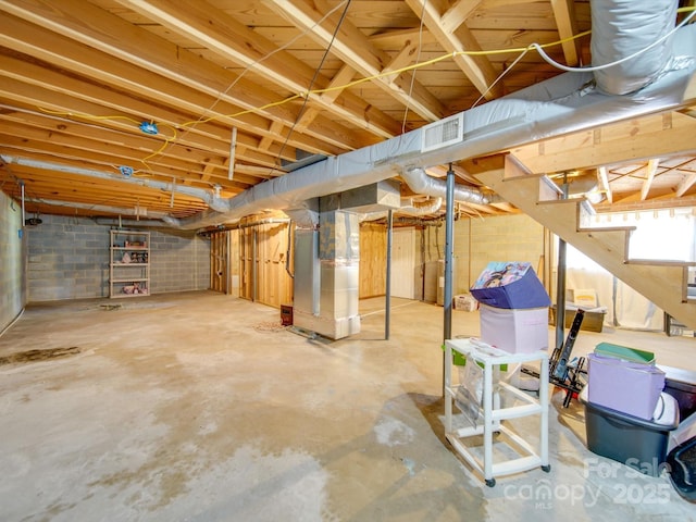 basement featuring heating unit