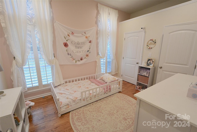 bedroom featuring hardwood / wood-style floors