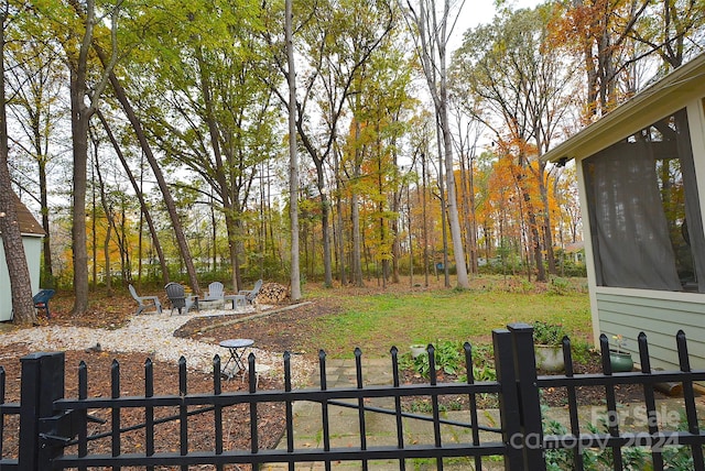 view of yard with a fire pit