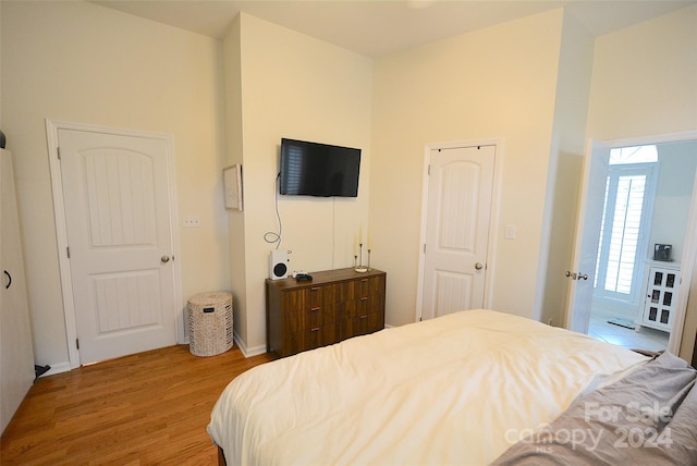 bedroom featuring a closet and light hardwood / wood-style flooring