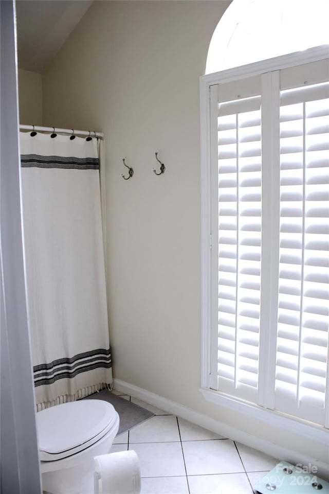 bathroom with tile patterned floors and toilet