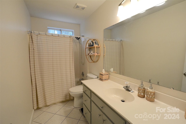 full bathroom with tile patterned floors, shower / bath combination with curtain, toilet, and vanity