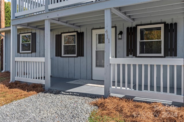 property entrance with covered porch