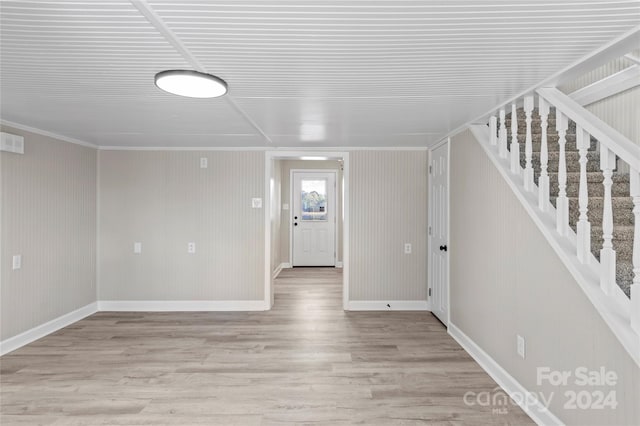 interior space featuring light hardwood / wood-style flooring and ornamental molding