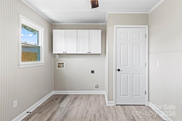 clothes washing area featuring washer hookup, cabinets, hookup for an electric dryer, crown molding, and light hardwood / wood-style floors