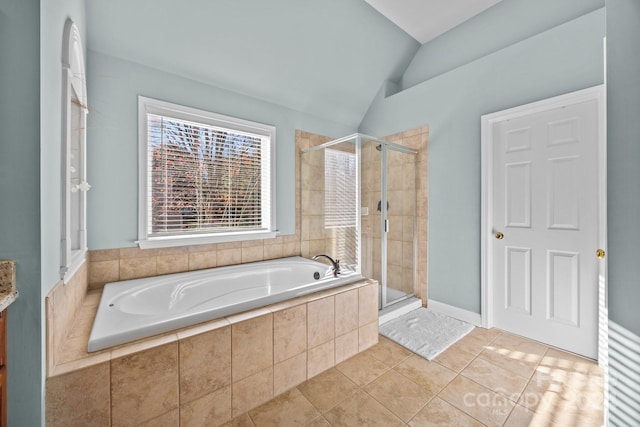 bathroom with tile patterned floors, plus walk in shower, and vaulted ceiling