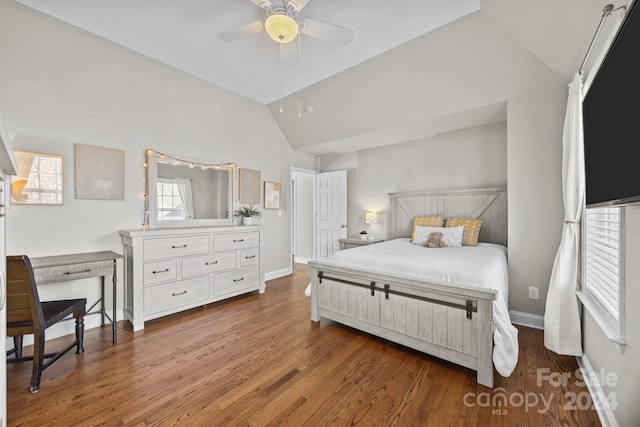 bedroom featuring ceiling fan, dark hardwood / wood-style floors, and lofted ceiling