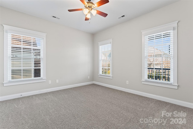 spare room with carpet flooring and ceiling fan