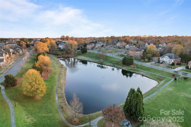 birds eye view of property featuring a water view and a residential view