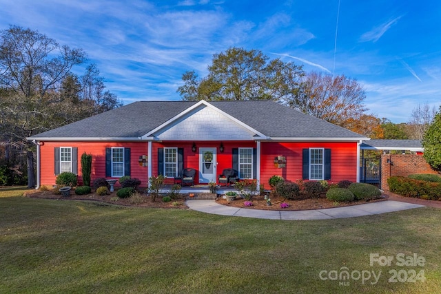 ranch-style home with a front lawn