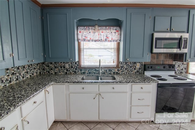 kitchen featuring tasteful backsplash, sink, blue cabinetry, electric stove, and white cabinets