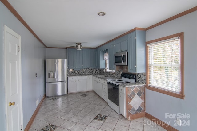 kitchen with appliances with stainless steel finishes, backsplash, ceiling fan, blue cabinetry, and light tile patterned floors