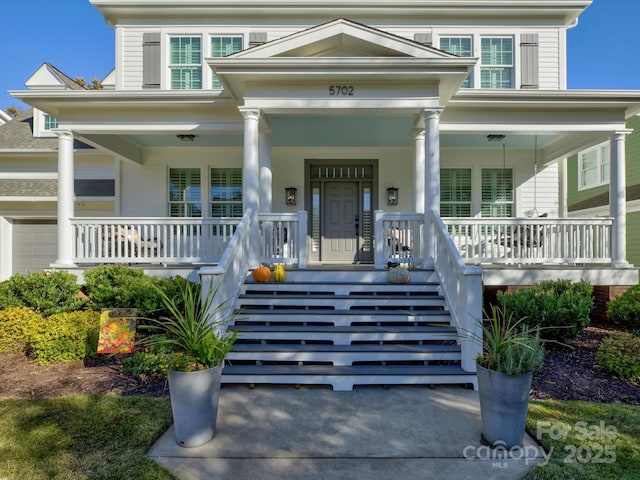 property entrance with covered porch