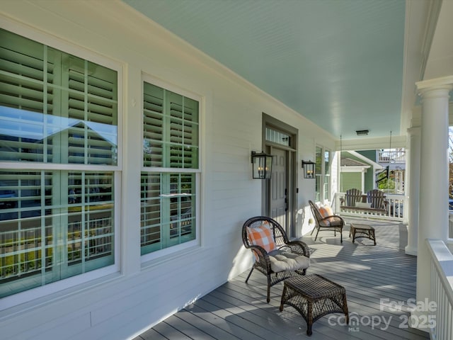 wooden deck featuring covered porch