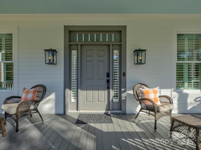 doorway to property featuring a porch