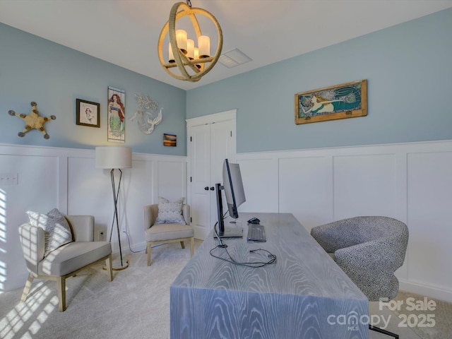 interior space with a chandelier and light carpet